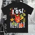 Black t-shirt with colorful graphic design and text on a textured gray background