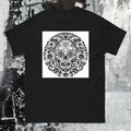Black t-shirt with a white skull design on a textured gray background